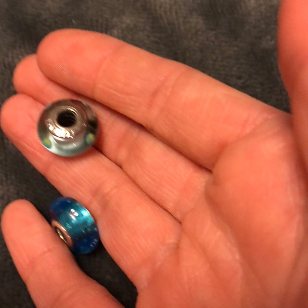 2 charms one green with green dots and one blue